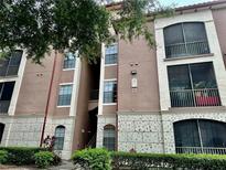 Exterior view of a three-story building with balconies at 6141 Metrowest E Blvd # 303, Orlando, FL 32835