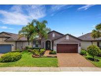 Single-Gathering home with landscaped yard and brick driveway at 668 Cordoba Dr, Davenport, FL 33837