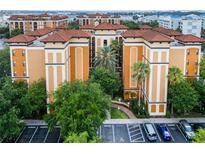 Aerial view of a building with several units and parking at 12539 Floridays Resort Dr # 305-D, Orlando, FL 32821