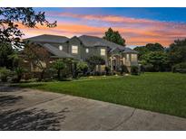 Stunning two-story home with a landscaped yard and driveway at 9502 Hempel Cove Blvd, Windermere, FL 34786