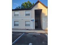 Exterior view of a two-story building with stairs and parking in front at 414 Banana Cay Dr # I, South Daytona, FL 32119