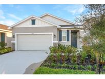 New construction home with two-car garage and landscaped front yard at 6333 Clover St, Lake Hamilton, FL 33851