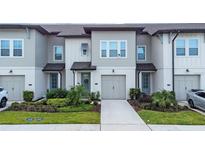 Modern townhome with two-car garage at 793 Benoi Dr, Davenport, FL 33896