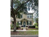 Two story house with green shutters at 7132 Five Oaks Dr, Saint Cloud, FL 34773