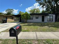 Charming updated ranch home with fresh gray paint and black trim at 1541 N Hudson St, Orlando, FL 32808