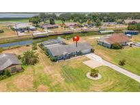 Aerial view of canal front home at 720 Shore Drive, Kissimmee, FL 34744