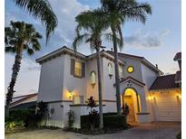 Two-story Mediterranean style home with lush landscaping at 730 Brunello Dr, Davenport, FL 33897