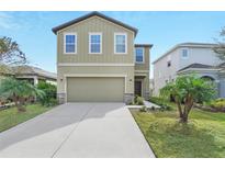 Two-story home with a two car garage at 3920 Saltmarsh Loop, Sanford, FL 32773