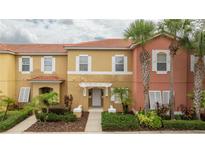 Two-story townhome with inviting front porch at 8545 Bay Lilly Loop, Kissimmee, FL 34747