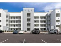 Modern building exterior with parking at 3171 Paradox Cir # 403, Kissimmee, FL 34746