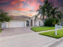 Single-Gathering home with two-car garage and landscaped front yard at 7978 Magnolia Bend Ct, Kissimmee, FL 34747