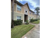 Attractive condo building with well-maintained landscaping at 9817 Turf Way # 8, Orlando, FL 32837