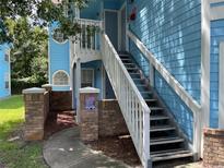 Exterior view showing stairs and building facade at 2717 N Poinciana Blvd # 179, Kissimmee, FL 34746