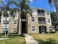 Three-story apartment building with screened balconies at 2305 Silver Palm Dr # 302, Kissimmee, FL 34747