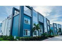 Modern building exterior with blue and white accents at 7740 Sandy Ridge Dr # 226, Kissimmee, FL 34747