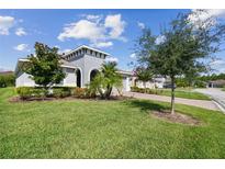Beautiful house exterior with landscaping and driveway at 742 San Joaquin Rd, Poinciana, FL 34759