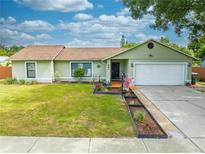 Light green house with two car garage at 961 Whisler Ct, St Cloud, FL 34769