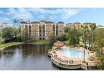 Aerial view of resort-style pool and building at 12538 Floridays Resort Dr # C-211, Orlando, FL 32821