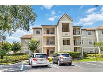Two-story condo building with ample parking at 3032 Parkway Blvd # 201, Kissimmee, FL 34747