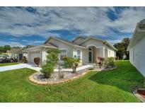 Attractive curb appeal with landscaping and walkway at 405 High Vista Dr, Davenport, FL 33837