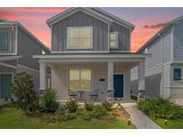 Two-story home with front porch at 2369 Volunteer Ave, Kissimmee, FL 34744