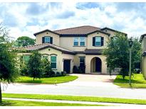 Two story home with a three car garage at 10091 Austrina Oak Loop, Winter Garden, FL 34787