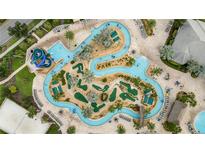 Aerial view of lazy river, pool, and mini golf at 4721 Clock Tower Dr # 302, Kissimmee, FL 34746