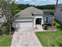 Single-Gathering home with brick driveway and lake view at 4742 Cumbrian Lakes Dr, Kissimmee, FL 34746