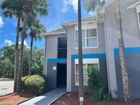 Building exterior with entrance and landscaping at 3100 Parkway Blvd # 611, Kissimmee, FL 34747