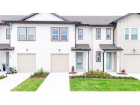 Newly built townhouses with attached garages at 718 Longboat Dr, Davenport, FL 33896
