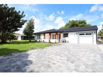 Charming single story home with a newly paved driveway at 10633 Watertown Ct, Orlando, FL 32821