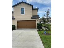 Two-story townhome with attached garage at 1523 Wynford Cir, Tavares, FL 32778