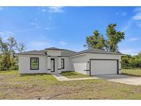 Single-story home with attached garage at 2396 Sw 147Th Lane Rd, Ocala, FL 34473