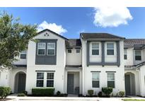 Three-story townhouses with modern design and landscaping at 274 Captiva Dr, Davenport, FL 33896