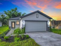 Modern single-story home with a two-car garage at 623 Sylvan Ramble Rd, Davenport, FL 33837
