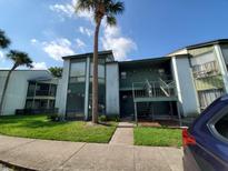 Condo building with ample parking and landscaping at 2616 Lemon Tree Ln # F, Orlando, FL 32839
