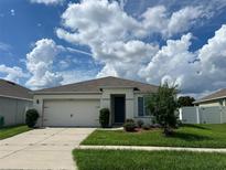 Exterior view of a single story home with a two-car garage at 3073 Royal Tern Dr, Winter Haven, FL 33881