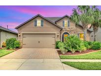 Beautiful two-story house with a large driveway and landscaped yard at 356 Toldedo Rd, Davenport, FL 33837