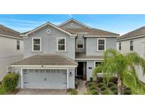 Two story house with a two car garage at 1536 Maidstone Ct, Davenport, FL 33896