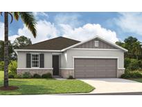One-story home with gray siding, brown roof, and attached garage at 648 Hennepin Loop, Lake Wales, FL 33898