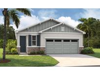 Two-story craftsman style home with a three car garage at 183 Bull Frog Ln, Umatilla, FL 32784