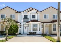 Two story townhome with front yard and driveway at 1256 S Beach Cir, Kissimmee, FL 34746