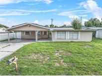 Charming ranch home with a large front yard at 912 Avenue T Se, Winter Haven, FL 33880