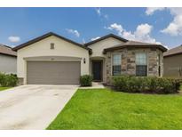 Two-story house with stone accents at 794 Citrus Isle Dr, Davenport, FL 33837