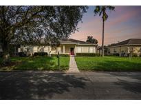 Charming one-story home with landscaped yard and two-car garage at 123 Gulf Dr, Kissimmee, FL 34759