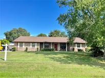 Brick ranch house with a large yard at 2867 Longleaf Ct, Kissimmee, FL 34746