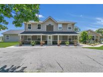 Two-story home with screened porch and landscaping at 3105 Pastures Rd, Kissimmee, FL 34746