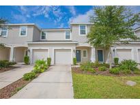 Two-story townhouse with a two car garage at 10556 Salt Grove St, Orlando, FL 32824