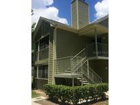 Two-story building with a staircase and screened porch at 3727 Lake Orlando Pkwy # 4, Orlando, FL 32809