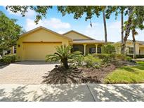 House exterior with a paved driveway at 196 Ventana Dr, Poinciana, FL 34759